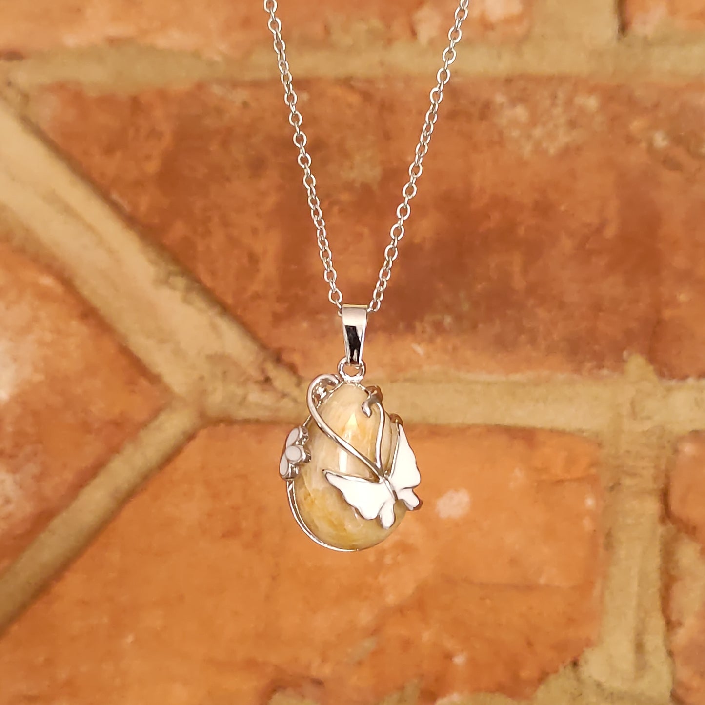 Rain Drop Shaped Crystal Pendants with Butterfly Mounted base Natural Stone Crystal Chakra Positive Energy